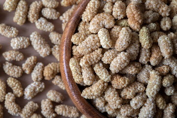 Bowl full of dried white mulberry 