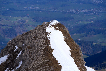 Aerial view over the Swiss Alps seen from Säntis peak at Alpstein Mountains on a sunny spring day. Photo taken April 19th, 2022, Säntis, Switzerland.