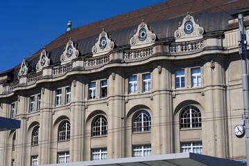 Fototapeta na wymiar Stone facade of railway main station of City of St. Gallen on a sunny spring day. Photo taken April 19th, 2022, St. Gallen, Switzerland.