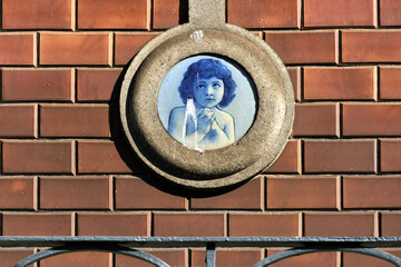 portrait of a child in azulejos on a facade in Porto, Portugal