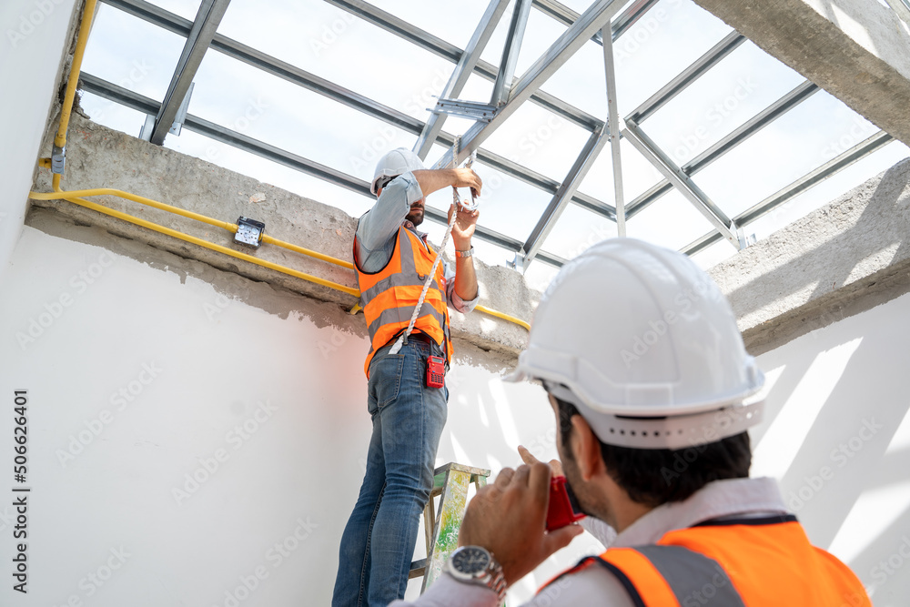 Aufkleber engineer technician watching team of workers on high steel platform at construction site,engineer wo
