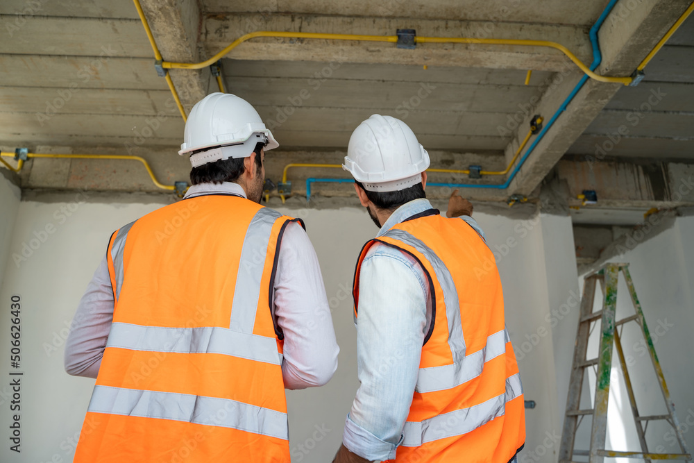 Aufkleber engineer and technician team working and discussing in new home construction site,construction engin