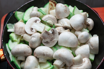 Fried mushrooms with zucchini . Preparing a Vegetarian Dinner