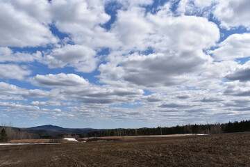 A field in spring under a cloudy sky, Sainte-Apolline, Québec, Canada