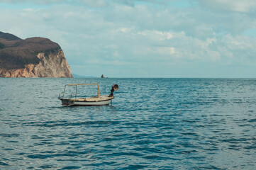 a boat without anyone stands in the sea, a beautiful seascape