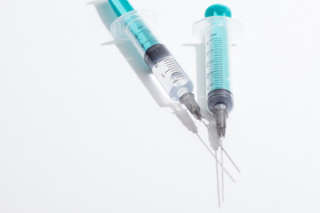 Medical syringe on a white background. A syringe for injection. The concept of health and beauty