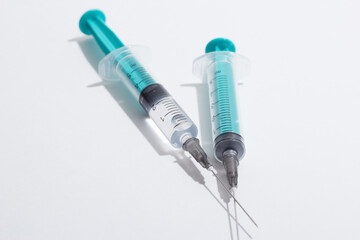 Medical syringe on a white background. A syringe for injection. The concept of health and beauty