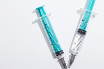Medical syringe on a white background. A syringe for injection. The concept of health and beauty