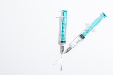 Medical syringe on a white background. A syringe for injection. The concept of health and beauty