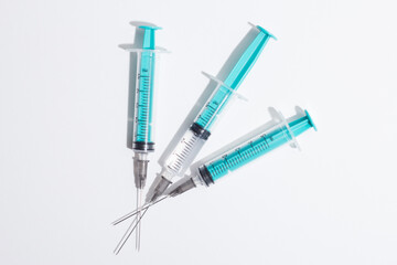 Medical syringe on a white background. A syringe for injection. The concept of health and beauty
