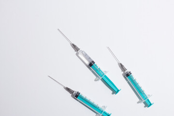 Medical syringe on a white background. A syringe for injection. The concept of health and beauty