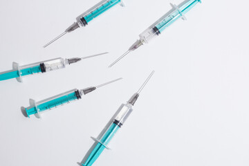 Fototapeta premium Medical syringe on a white background. A syringe for injection. The concept of health and beauty