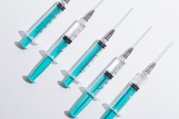 Medical syringe on a white background. A syringe for injection. The concept of health and beauty