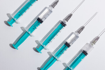 Medical syringe on a white background. A syringe for injection. The concept of health and beauty