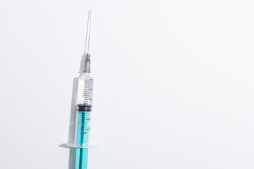 Medical syringe on a white background. A syringe for injection. The concept of health and beauty