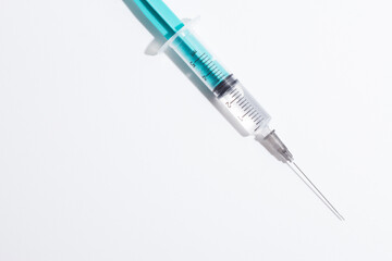 Medical syringe on a white background. A syringe for injection. The concept of health and beauty