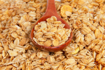Oatmeal cereal breakfast in wooden spoon textured background