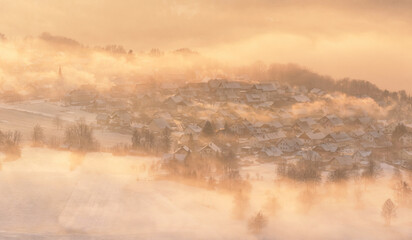 Slovenian countryside on a foggy and winter afternoon