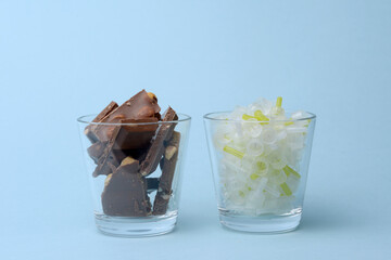 Glass of insulin needles with chocolate diabetes concept isolated