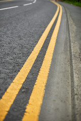 Double solid line of road markings in yellow. Perfectly clean border. Yellow road markings