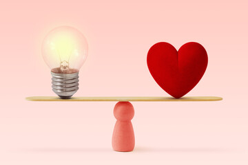 Light bulb and heart on scale on pink background- Concept of woman and balance between heart and...
