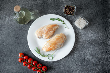 grilled chicken fillet on stone background