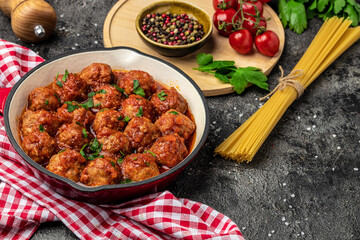 Traditional spicy meatballs in sweet and sour tomato sauce. Restaurant menu, dieting, cookbook recipe top view