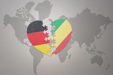 puzzle heart with the national flag of republic of the congo and germany on a world map background. Concept.