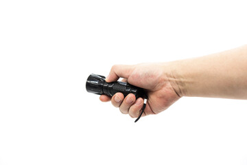 Closeup of hand holding small black flashlight isolated on white background - obrazy, fototapety, plakaty