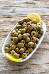 Green olive. natural olive on wood floor background. Healthy food. close up