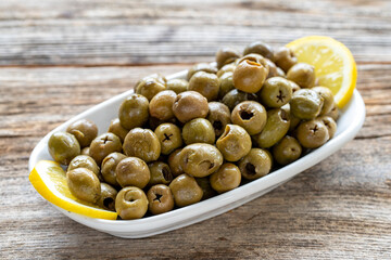 Green olive. natural olive on wood floor background. Healthy food. close up