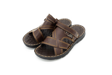 Pair of brown leather fashion slippers closeup on white background