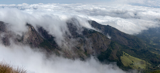 Sea of clouds over mountains, forming a wave over the summits, sea of fog, mountain with fog, Teresópolis, Rio de Janeiro, Brazil