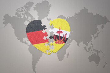 puzzle heart with the national flag of brunei and germany on a world map background. Concept.