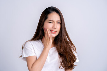 Young asian woman isolated on white background having a strong teeth pain, molar ache.