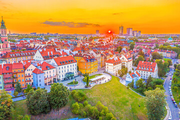 Beautiful panoramic aerial drone skyline sunset view of the Warsaw City Centre with skyscrapers of the Warsaw City and Warsaw's old town with a market square and a mermaid statue, Poland, EU
