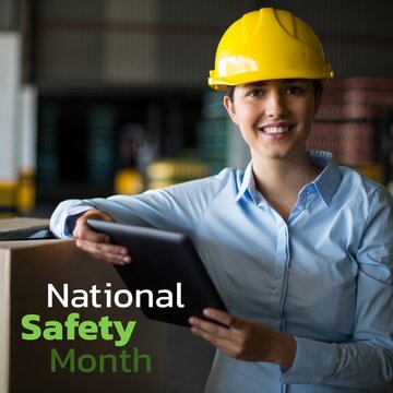 National safety month text by female caucasian warehouse supervisor wearing hardhat holding table pc