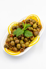 Green olive. Olives with special sauce isolated white background. Healthy food. close up
