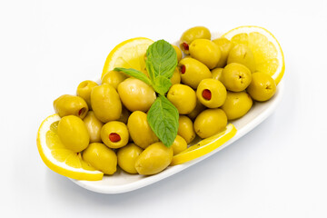 Green olives stuffed with peppers. Natural peppered olives on isolated white background. Healthy food. close up