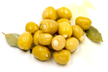Green olives stuffed with cheese. Cheese filled olives for breakfast on isolated white background. Healthy food. close up