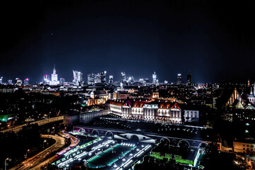 Fototapeta na wymiar Aerial view of old buildings, castles and a church in the old city of Warsaw. Cityscape of old buildings and architecture in the old town in Warsaw. Night time