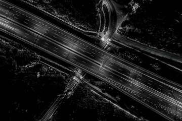 Aerial view of landscape perfect night road, top view at night traffic long exposure. color tone effect. Black and white
