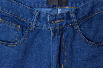 Fototapeta premium Jeans close-up. Modern comfortable clothes. Denim blue jeans texture