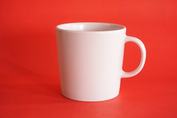 white cup on red background