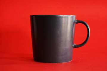 black coffee cup on red background