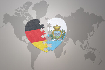 puzzle heart with the national flag of san marino and germany on a world map background. Concept.