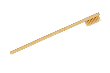 Wooden toothbrush on a white background, top view, isolate