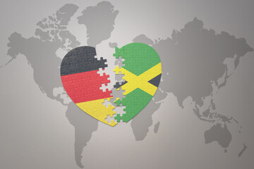 puzzle heart with the national flag of jamaica and germany on a world map background. Concept.