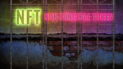 neon message NFT - NON FUNGIBLE TOKEN in front of a dark wall