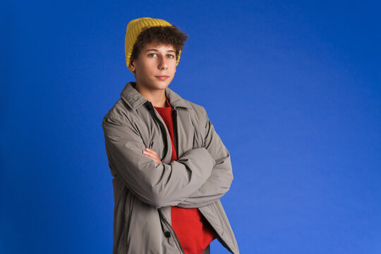White boy wearing hat posing and looking at camera
